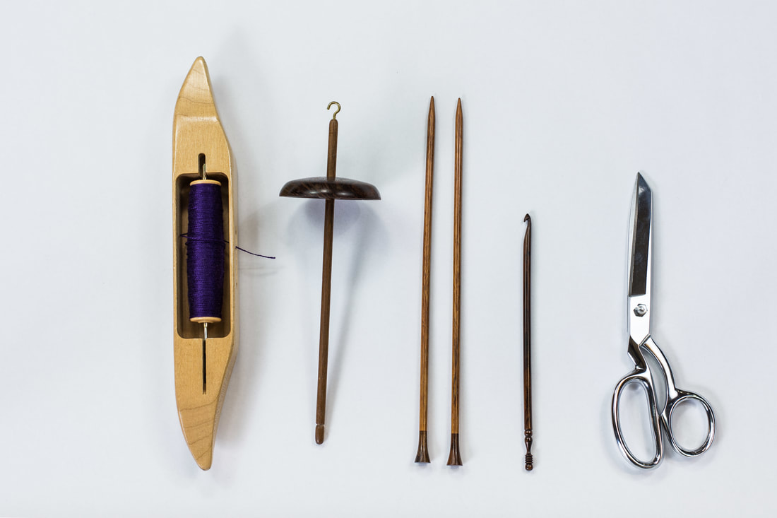 Shuttle, spindle, knitting needles, crochet hook, and scissors. From thefibersprite.