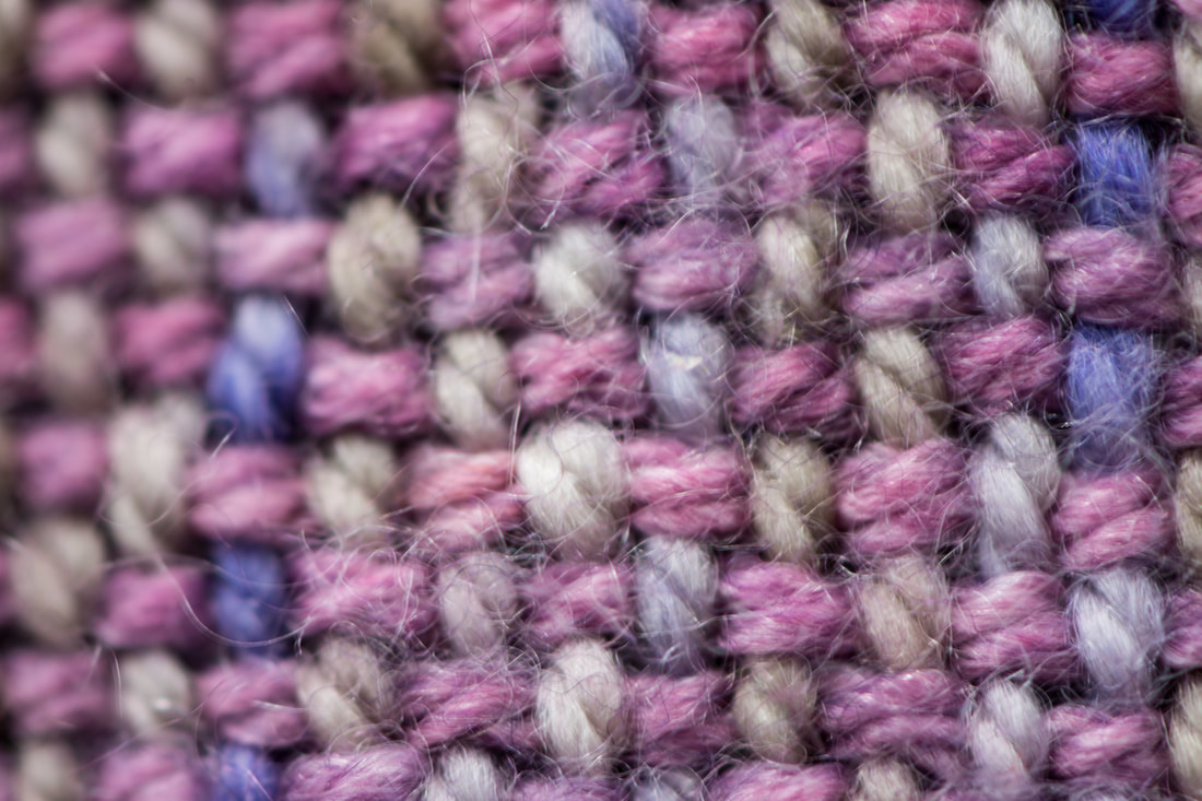 A super close-up image of handwoven fabric. From thefibersprite.