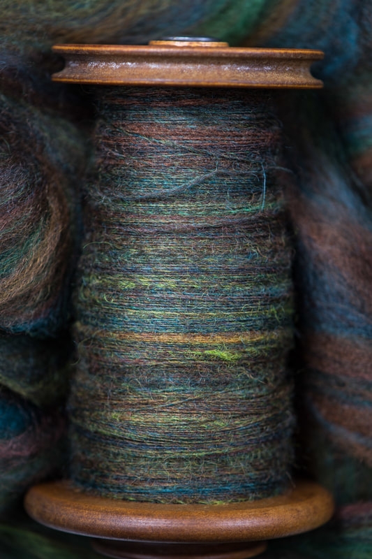 A bobbin of handspun yarn. From thefibersprite.